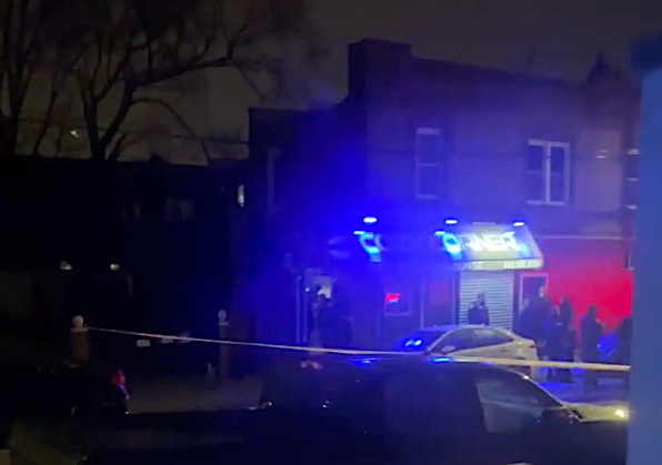Police investigate outside a bar where a man was shot and killed in St. Albans on Monday night