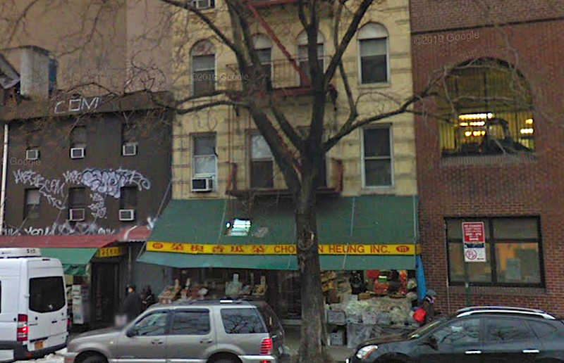 The victim was stabbed in her apartment on Chrystie Street early Sunday. Surveillance video shows a man lurking behind her in the hallway of the building