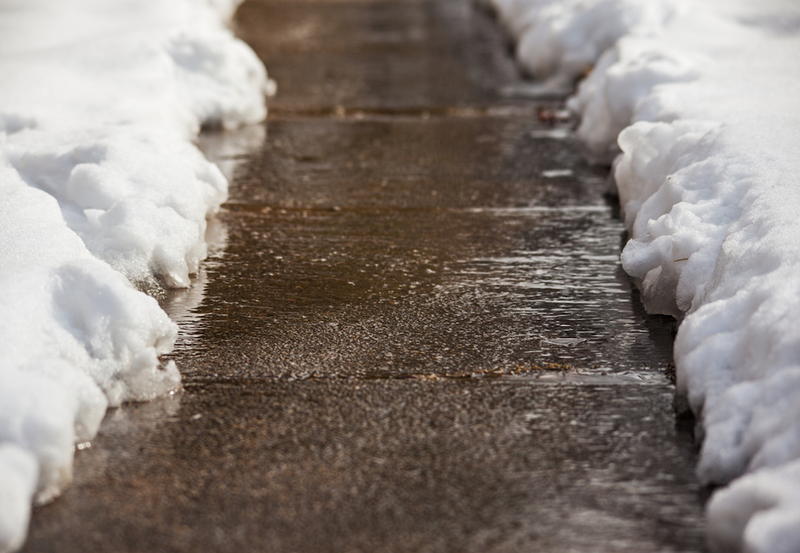 sidewalk edged with snow