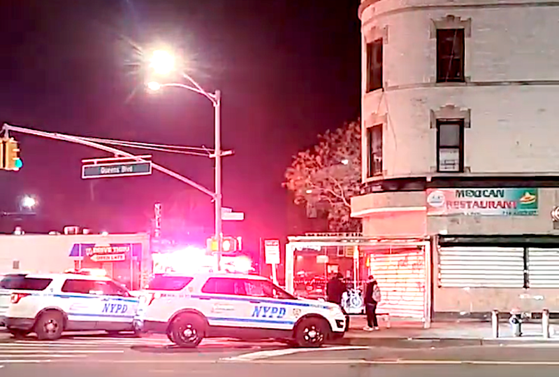 NYPD officers outside the Jamaica-Van Wyck station in Kew Gardens after a man was stabbed during an attempted robbery there Saturday morning