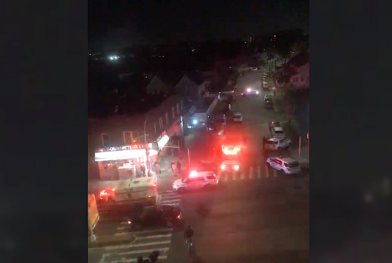 Police and EMS at the scene of the stabbing in Jamaica around 6:30 p.m. Monday