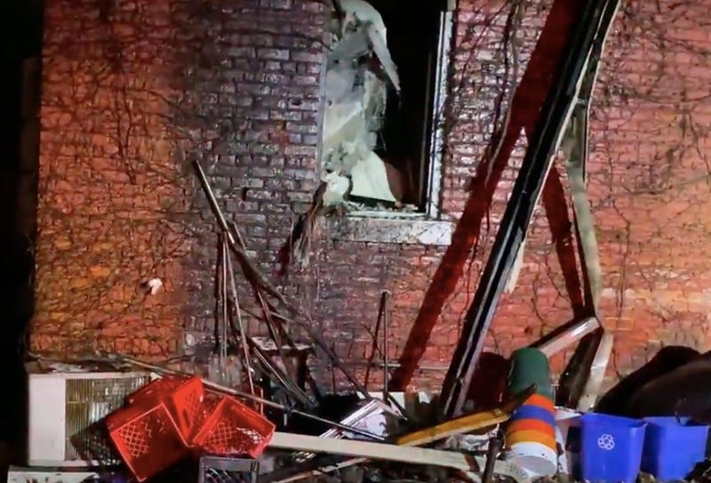 Burnt brick building with debris