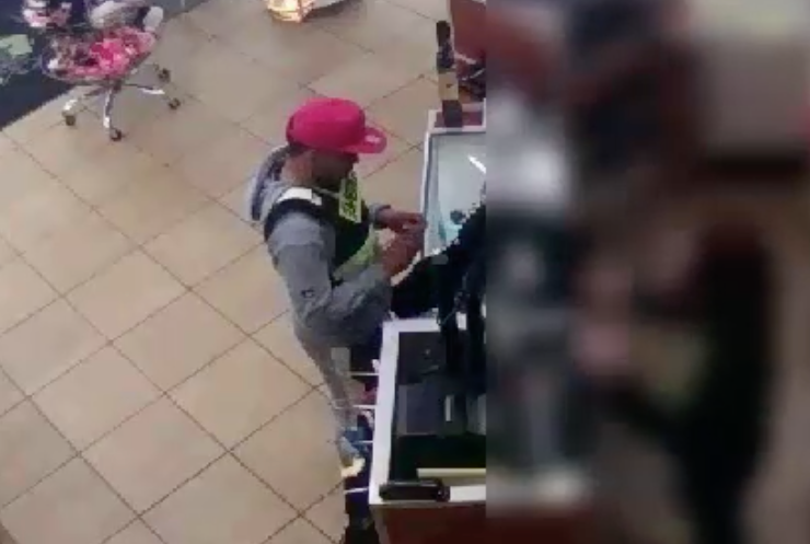 The suspect at a Journeys on W. 14th Street about an hour after the attack
