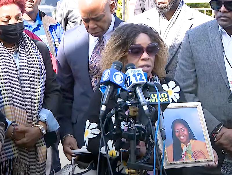Jennifer Jones Ellis holds a photo of her 20-year-old daughter, Jenna Ellis, who was critically injured in the shooting