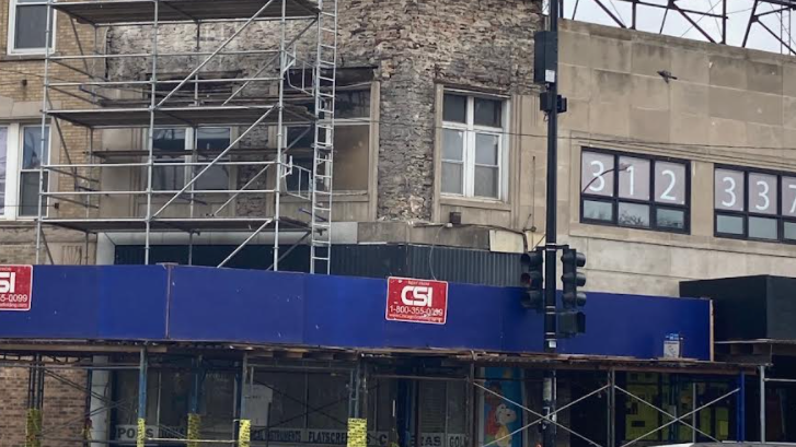 Woman remains hospitalized for head injuries after building façade falls on her: law firm