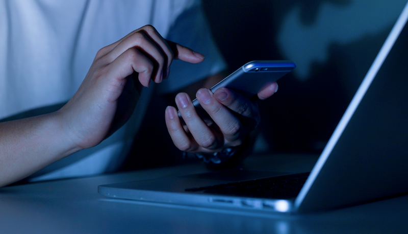 teen with cell phone, laptop