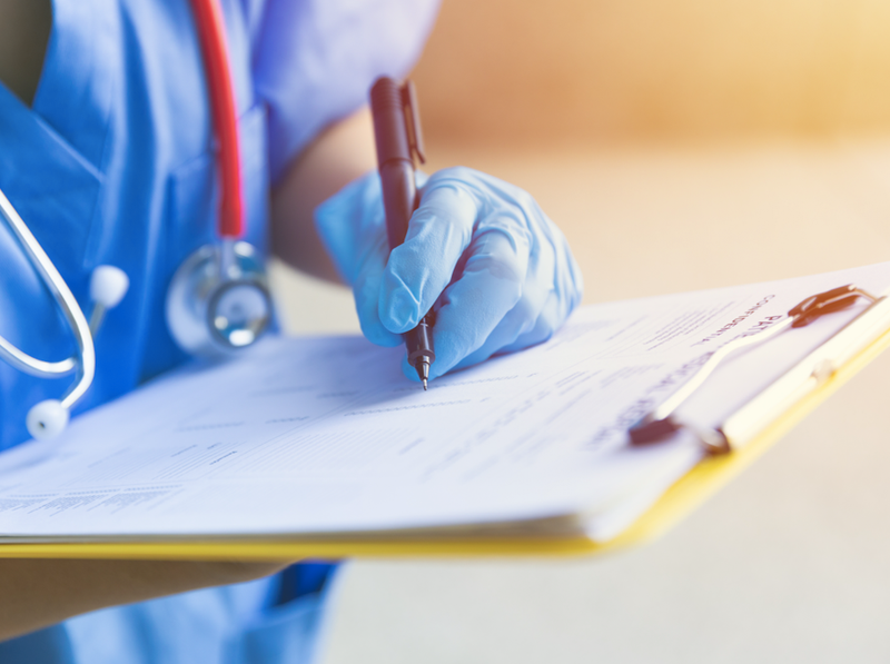 nurse with clip board