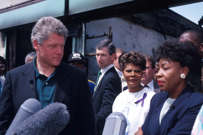 Presidential candidate Governor Bill Clinton (D-AR) stands with singer Dionne Warwick and US Representative Maxine Waters (D-CA) May 4, 1992, in Los Angeles. The south-central area of Los Angeles was torn with riots following the acquittal of five officers who were accused of beating African-American Rodney King.
