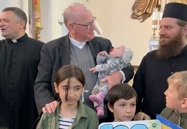 Cardinal Dolan met with refugees in Poland following an unannounced weekend visit to Lviv, Ukraine