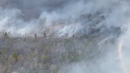 Northern Michigan wildfire caused by lightning strike continues to burn, firefighters contain 75%