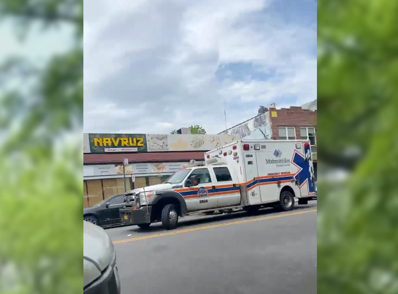 An ambulance outside Navruz Market at 1701 McDonald Ave. in Midwood on Monday afternoon