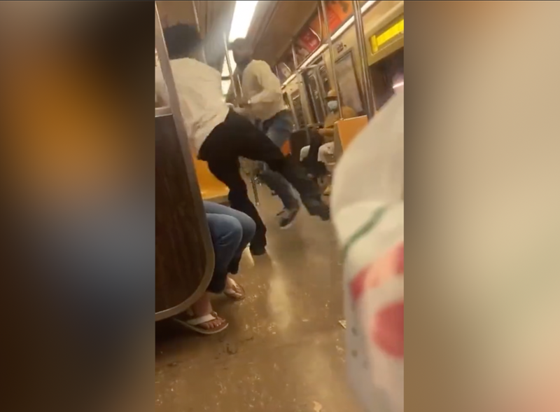 Video shows two men brawling on an uptown A train in Manhattan on Wednesday afternoon as riders take cover
