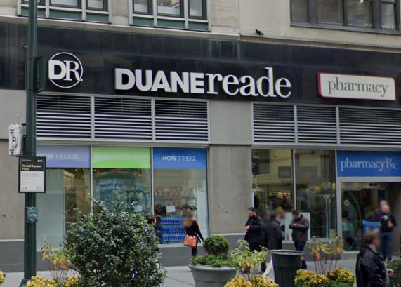 A beer shoplifter punched an off-duty NYPD cop working as security at a Midtown Duane Reade on Sunday morning.