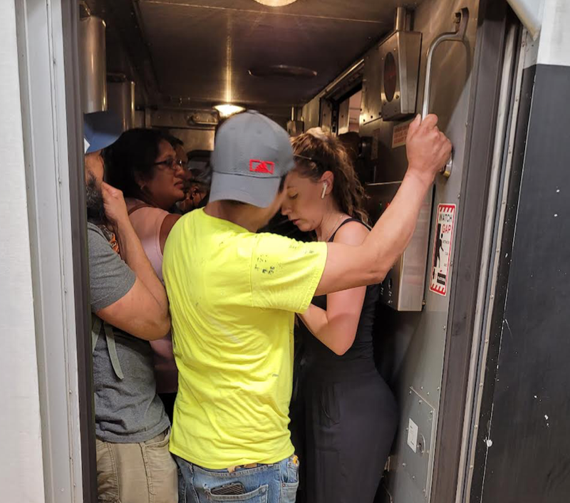 People squeeze to try and make it on one of the NJ Transit trains not canceled Friday.