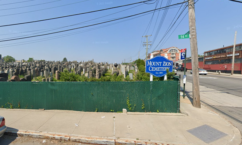 A man who was asleep under a van in Queens was killed Tuesday after the driver returned to the vehicle and inadvertently ran him over.