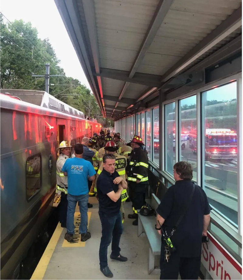 Crews rescue woman from underneath train