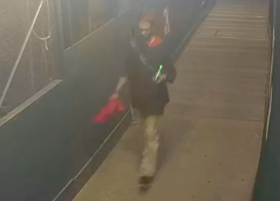 Police released an image of a suspect who they said threatened two men with a hammer on Fifth Avenue, just outside of Central Park
