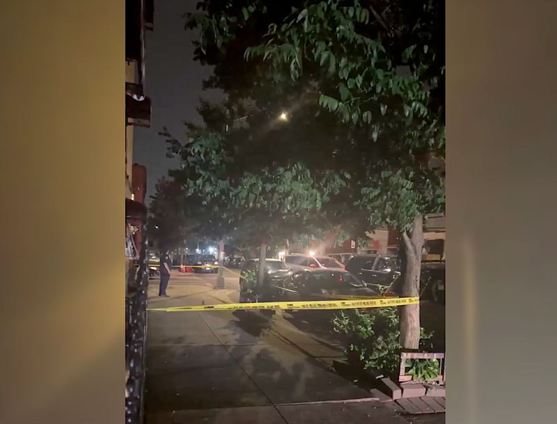 Police tape up at the scene of a shooting in the Charlotte Gardens section of the Bronx