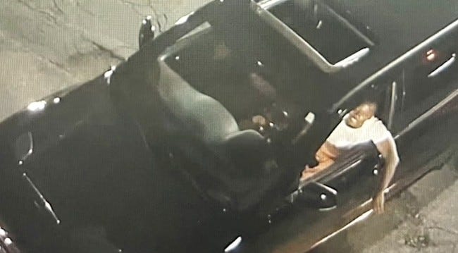 Suspect hanging out of car window