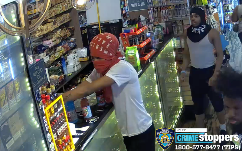 New video shows a gunman holding up a cashier at Lincoln Convenience on Broadway early Monday as several of his accomplices grab CBD products, police said