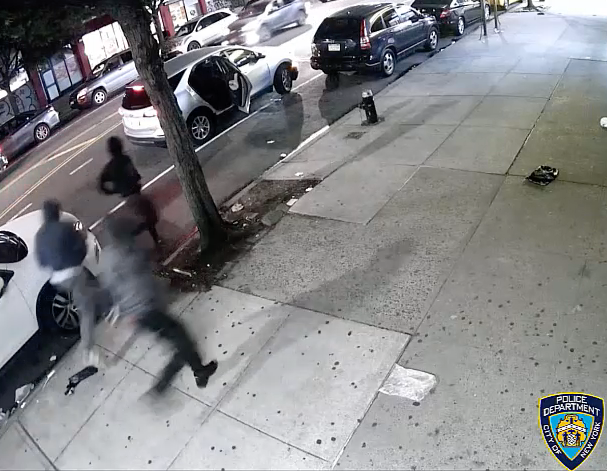 Video shows the suspects fleeing back to a silver SUV after robbing an off-duty NYPD officer and his two cousins in Inwood early last Friday morning