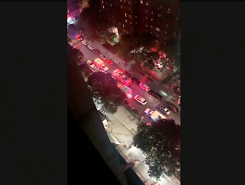 Police and EMS filled the street outside 3073 Park Ave. following the shooting Wednesday night