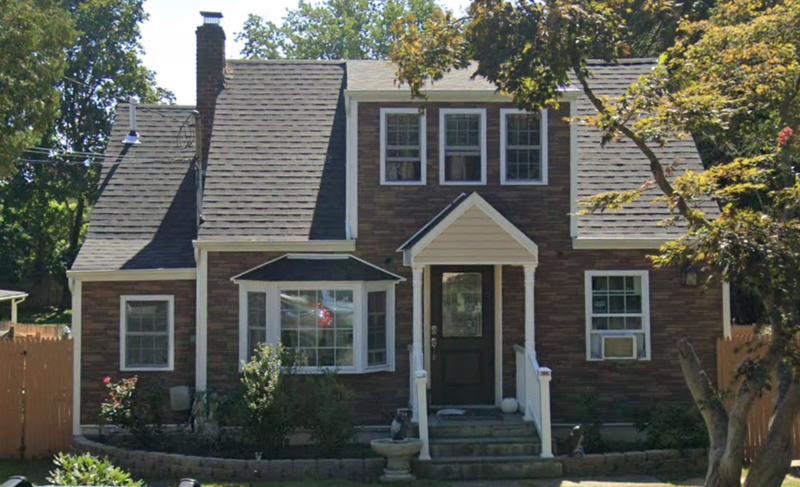 A man was shot dead answering his door in Huntington Station, police said.