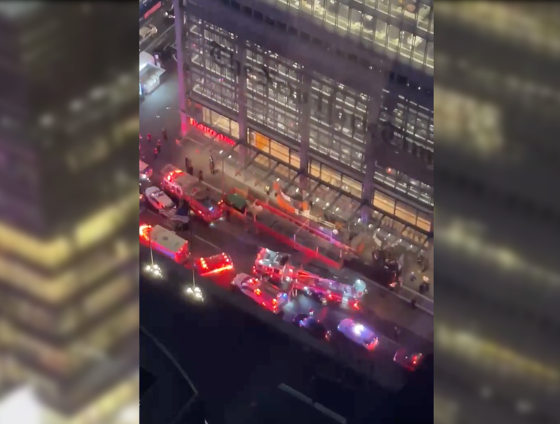 There was a heavy emergency response outside the New York Times building around 7:30 p.m. Tuesday as crowds watched the man climb the tower