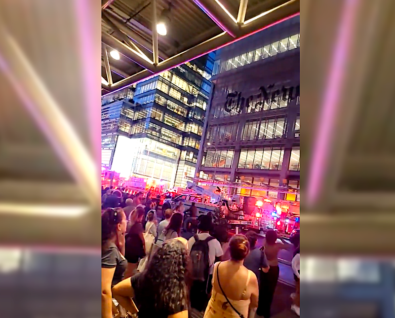 A man accused of injuring a cop with a “two-by-four riddled with nails” climbed the New York Times building Tuesday evening and threatened to harm himself with a knife, according to reports