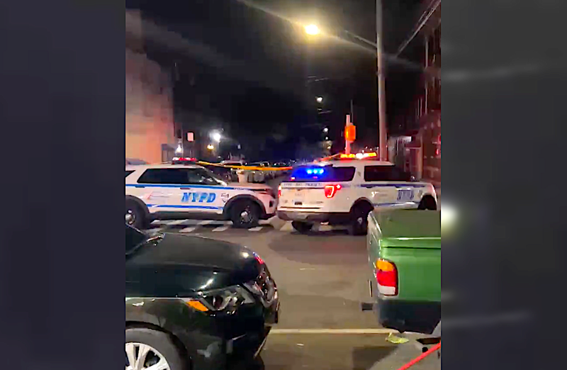 Police respond to the scene of the shooting at 702 Sheffield Ave. around 11:15 p.m. Wednesday