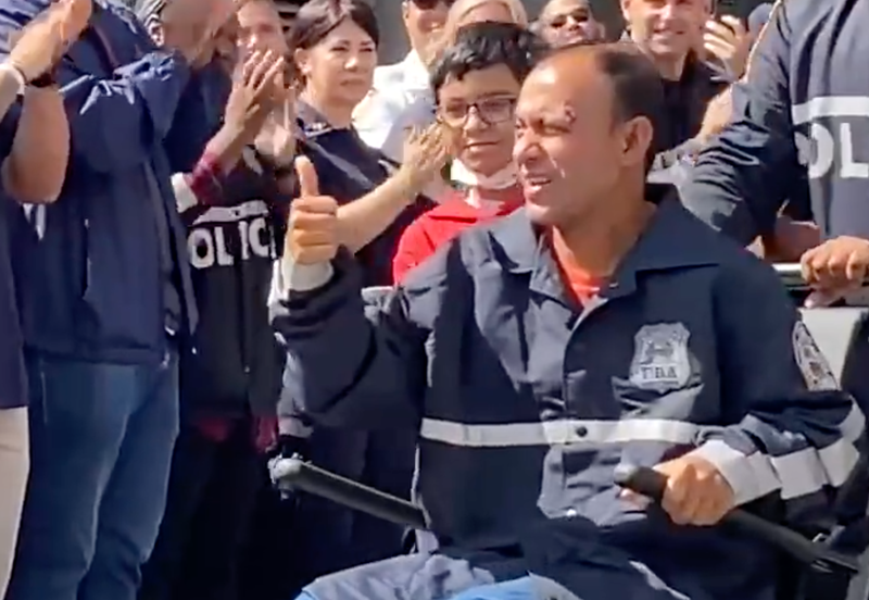 NYPD Officer Muhammed Chowdhury is cheered on by hundreds of fellow cops after he was robbed and beaten while off-duty last month.