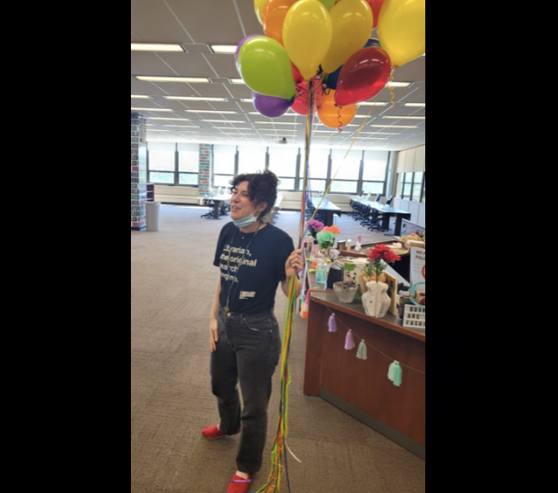 Librarian with balloons