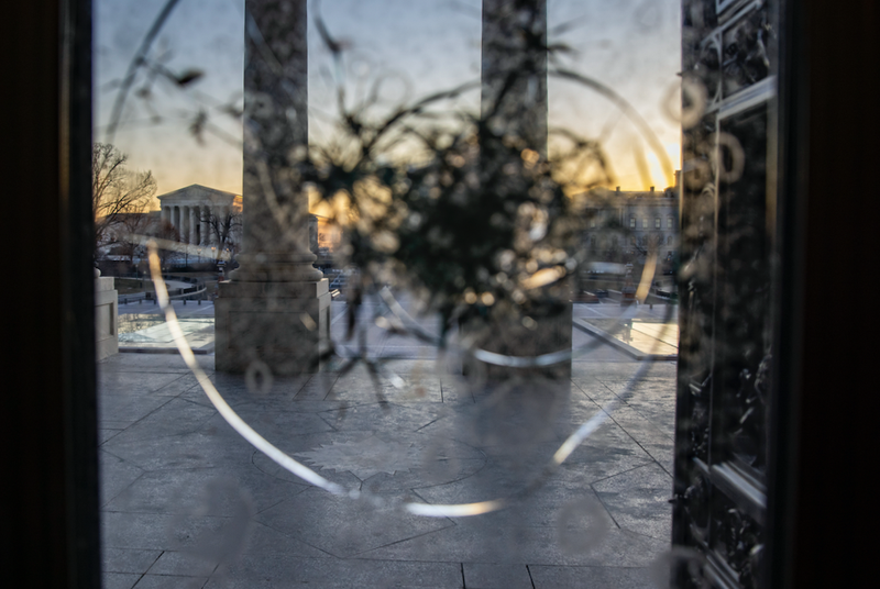 Capitol after breach, through cracked window