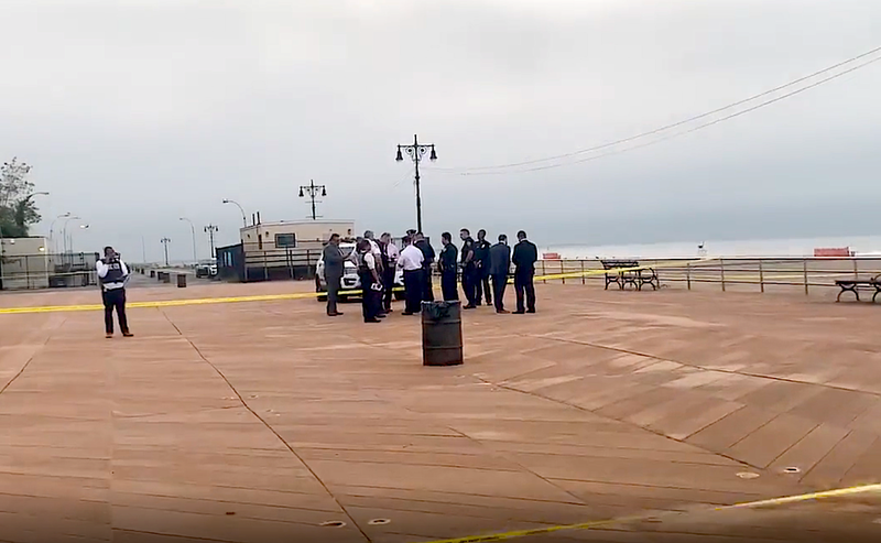 The police investigation continued at the beach into Monday morning