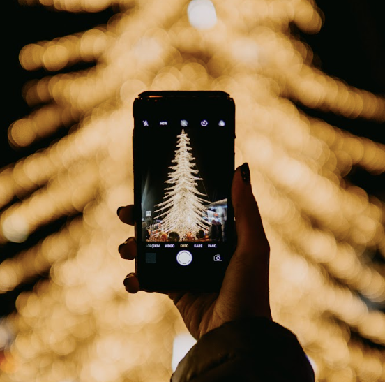 smart phone in front of light display
