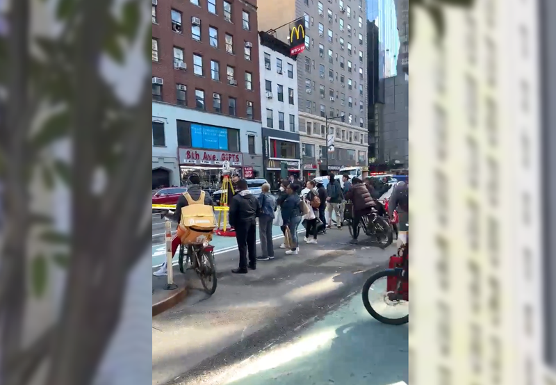 Onlookers watched as the investigation continued into the afternoon, with Eighth Avenue closed at W. 42nd Street