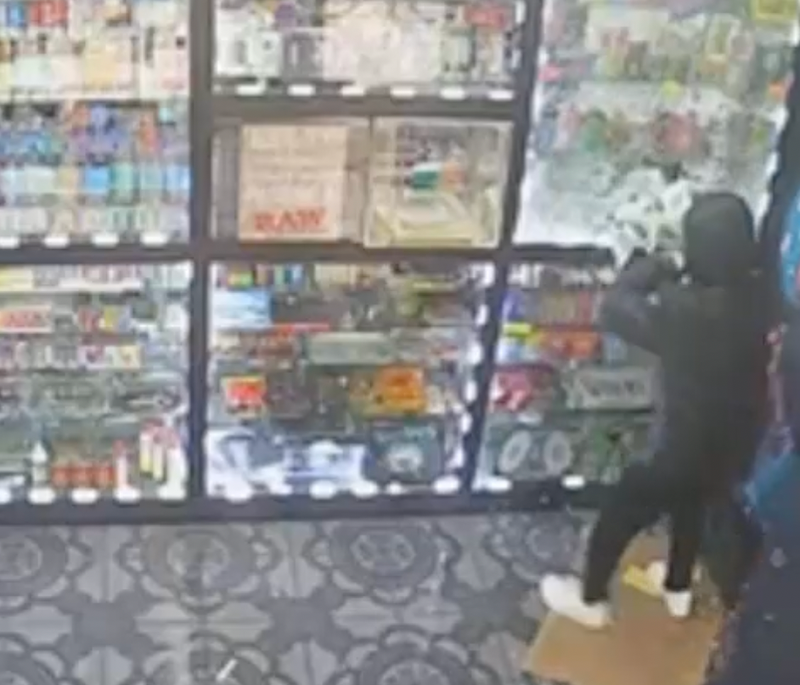 Surveillance image of robbery in process