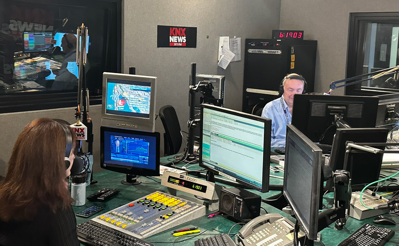 Dick Helton (R) sits beside Vicky Moore (L) during his final KNX broadcast on Oct. 14, 2022.