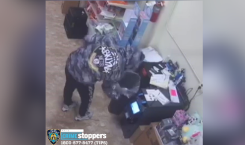 Burglar robbing Staten Island Family Dollar