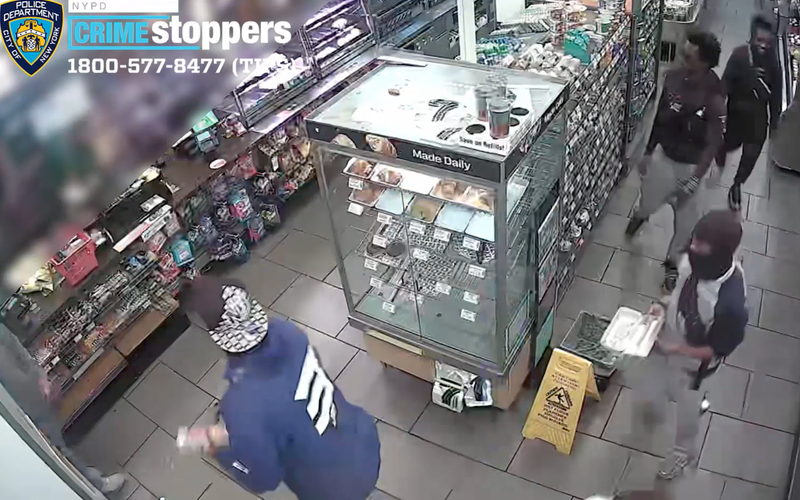 Video shows the group throwing eggs and other items at the worker, who ducks behind the checkout counter