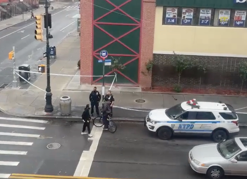 A 70-year-old woman was shot on a Brooklyn street corner Monday afternoon, police said.