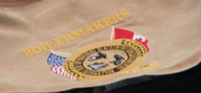 Boilmakers union emblem on Young's jacket which helped to identify him.