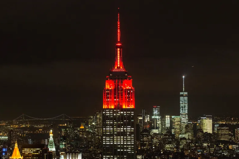 The Empire State building is lit with red lights in honor of World Aids Day on November 30, 2015 in New York City.