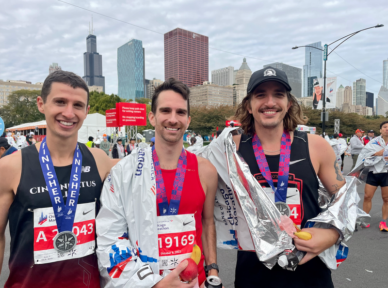 Chicago Marathon racers smile for a photo after completing the race.