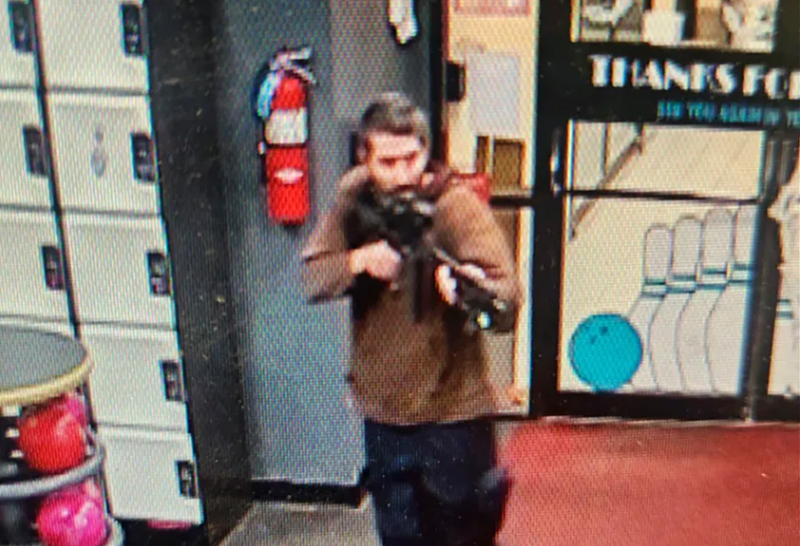In this image taken from video released by the Androscoggin County Sheriff's Office, an unidentified gunman points a gun while entering Sparetime Recreation in Lewiston, Maine, on Wednesday, Oct. 25, 2023.