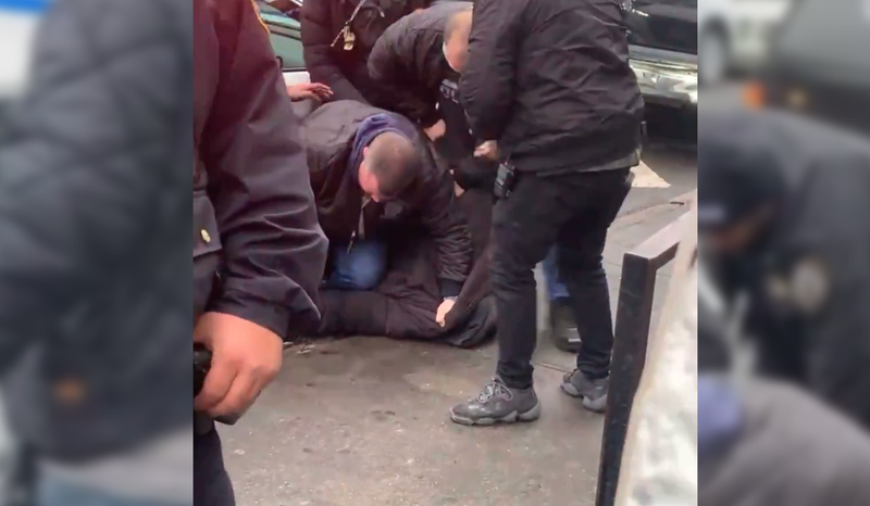Donald Davis being arrested in Queens Friday.