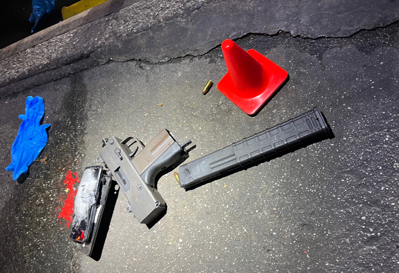 The MAC-10 submachine gun with a 30-round extended magazine recovered from the crime scene.