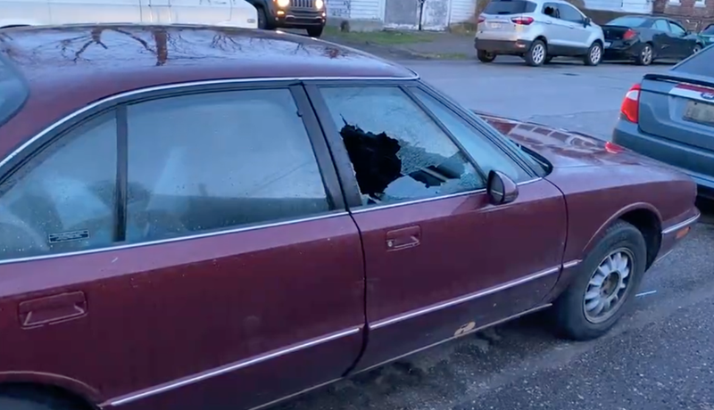 Smashed window of vehicle on Detroit's east side