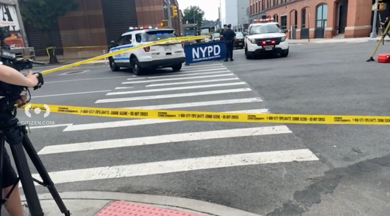 Citizen App footage from the location of a collision that killed a cyclist in Hell's Kitchen on Friday shows members of the NYPD documenting the scene.