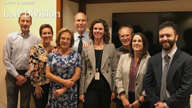 Paul George (center, with tie) pictured with his colleagues in the law division of the District Attorney's Office. George was disbarred by a federal judge after a disciplinary panel determined he misrepresented facts in order to vacate a death sentence.